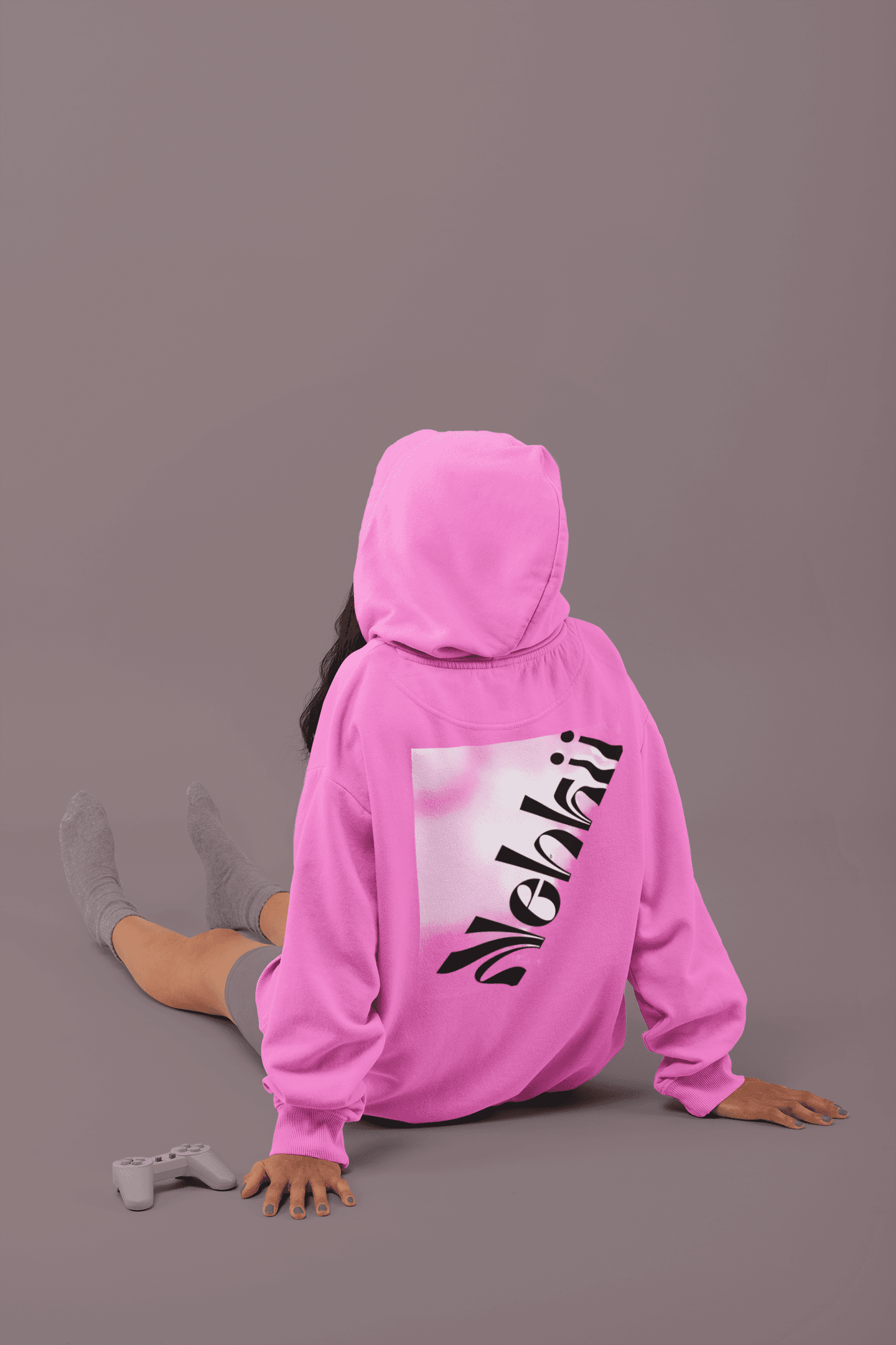 Pink women's fleece hoodie with bold motivational print on back. Soft, eco-conscious activewear ideal for lounging or casual street style.