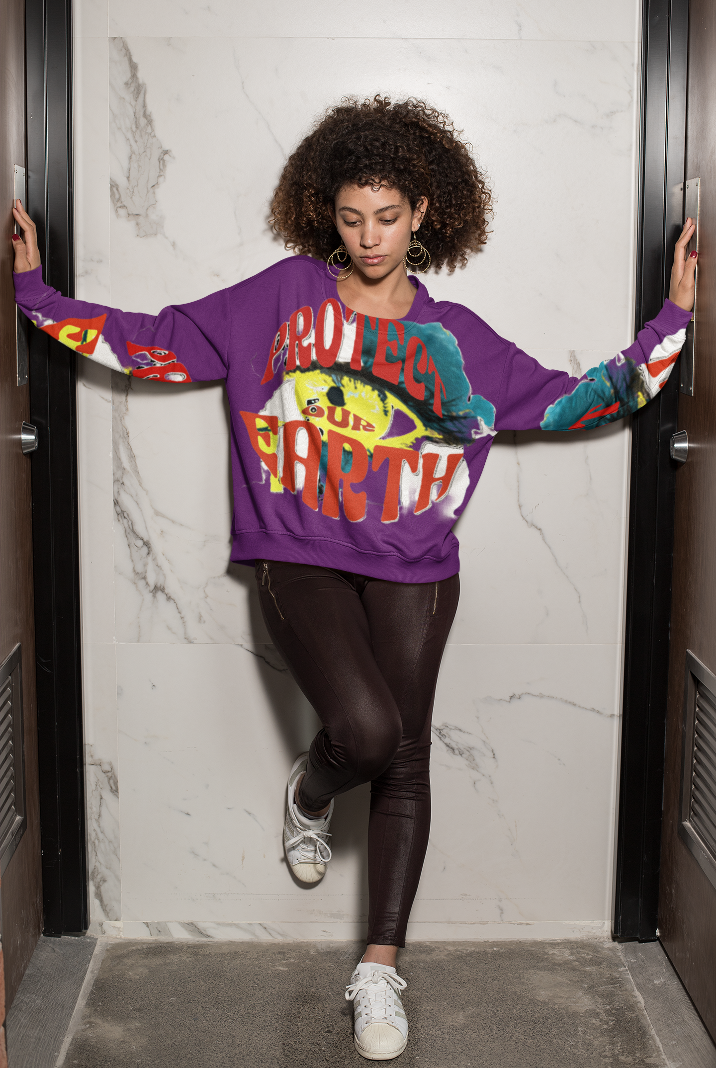 Sustainable Eco Cotton Women's Sweatshirt in purple with bold Earth-themed print, combining eco-conscious fashion with cozy everyday wear.