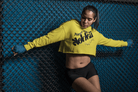 Women's Graphic Hoodie - Bold Style Fierce Spirit in yellow, cropped silhouette with fierce black graphic, great for bold fashion statements.