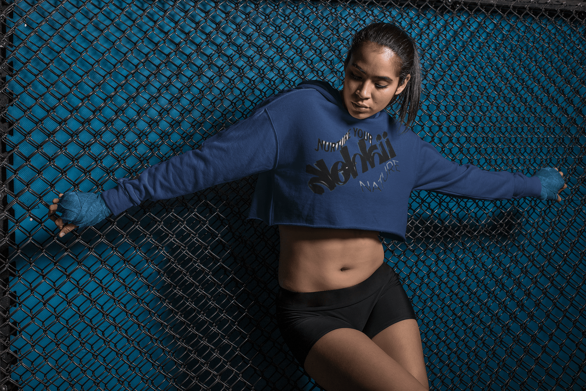 Women's Graphic Hoodie - Bold Style Fierce Spirit in navy blue, cropped design with bold black graphic, perfect for sporty and urban outfits.