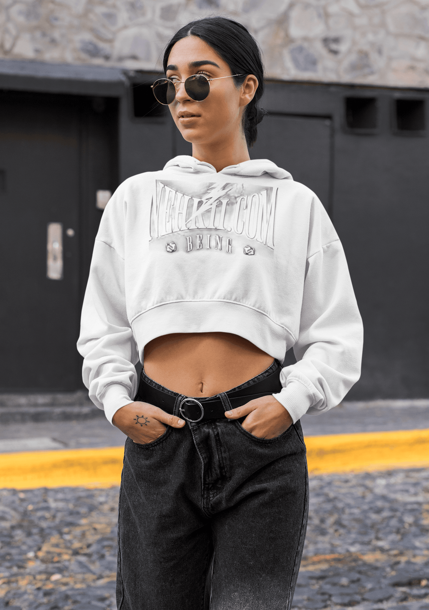 White sustainable women's hoodie with cropped cut and bold graphic, perfect for eco-conscious fashion and all-season comfort.
