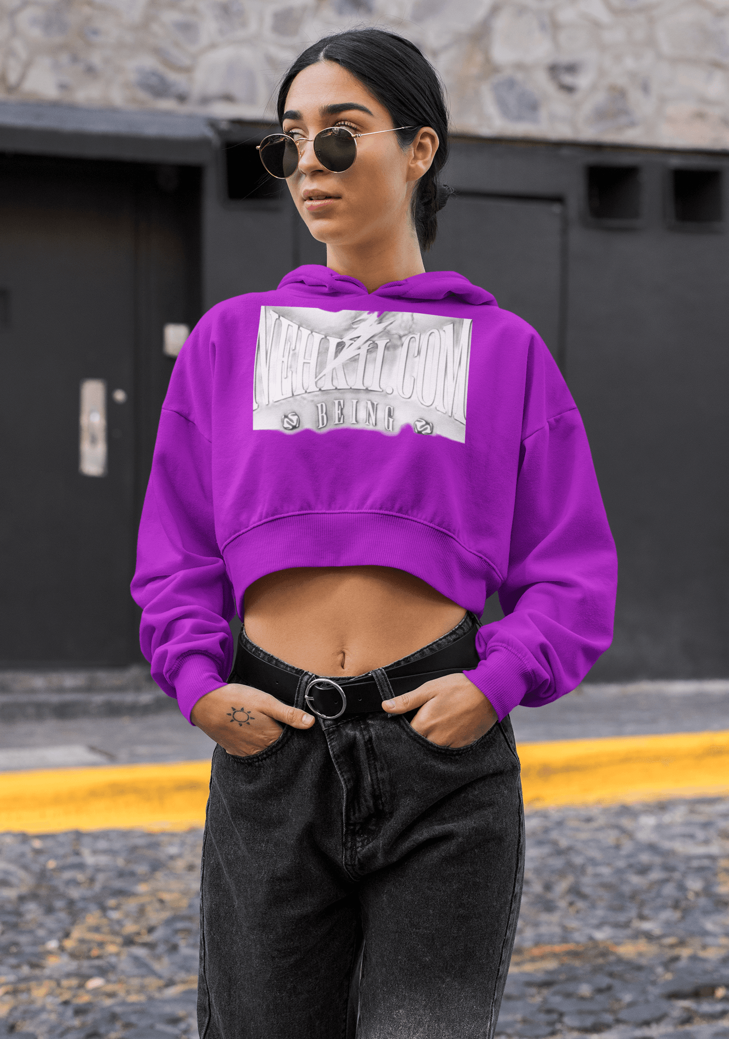 Purple cropped eco hoodie for women with bold chest print, offering breathable comfort and sustainable fashion appeal.