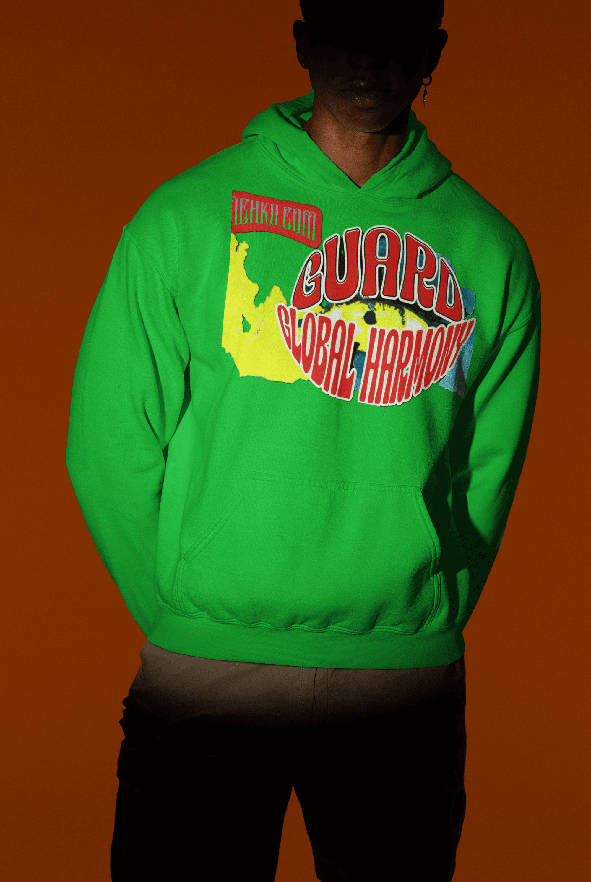 Green sustainable cotton women’s crop hoodie with vibrant 'Guard Global Harmony' design, perfect for ethical streetwear enthusiasts.