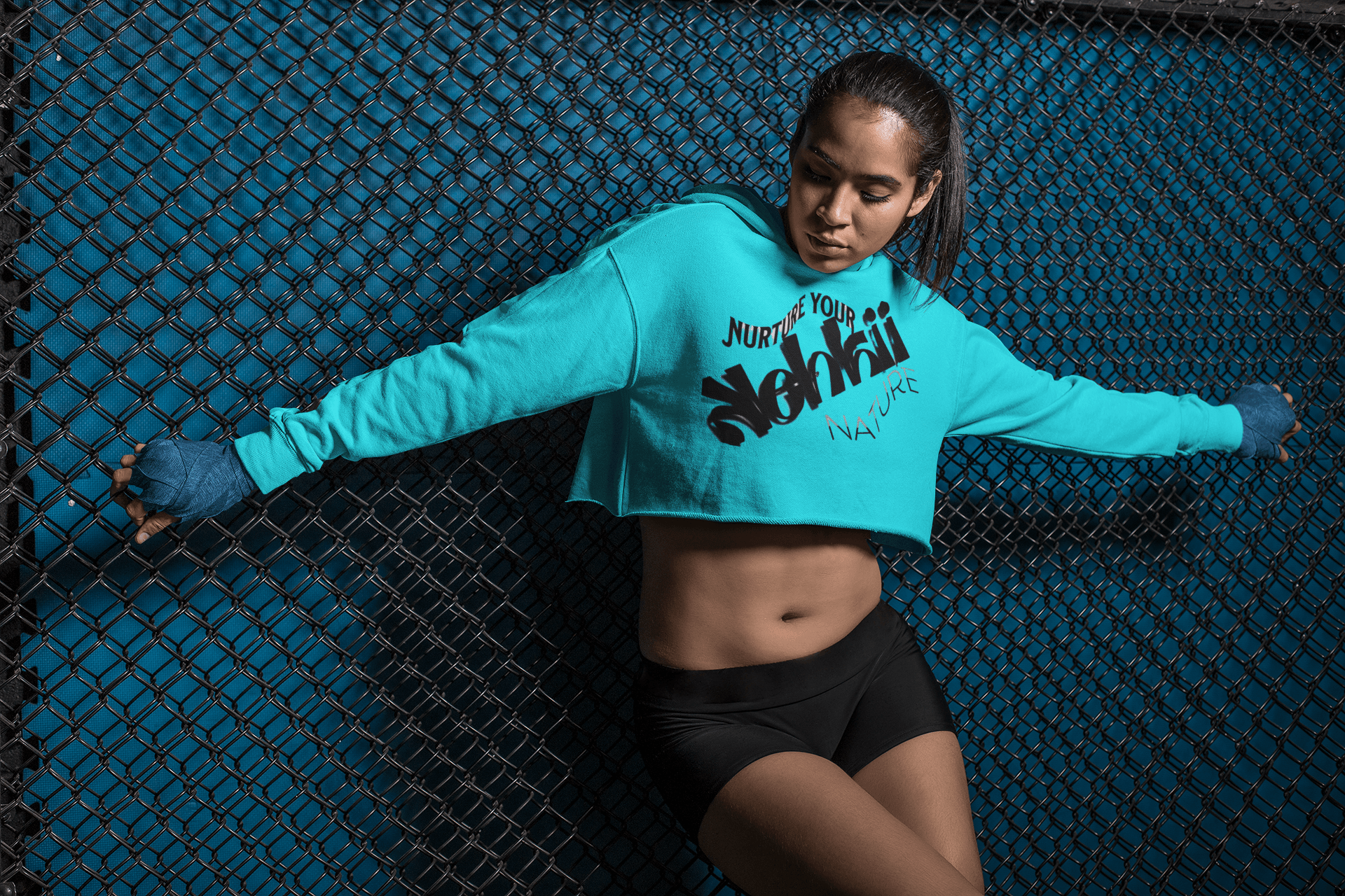 Women's Graphic Hoodie - Bold Style Fierce Spirit in teal blue, cropped design with empowering text, ideal for fitness and casual fashion.
