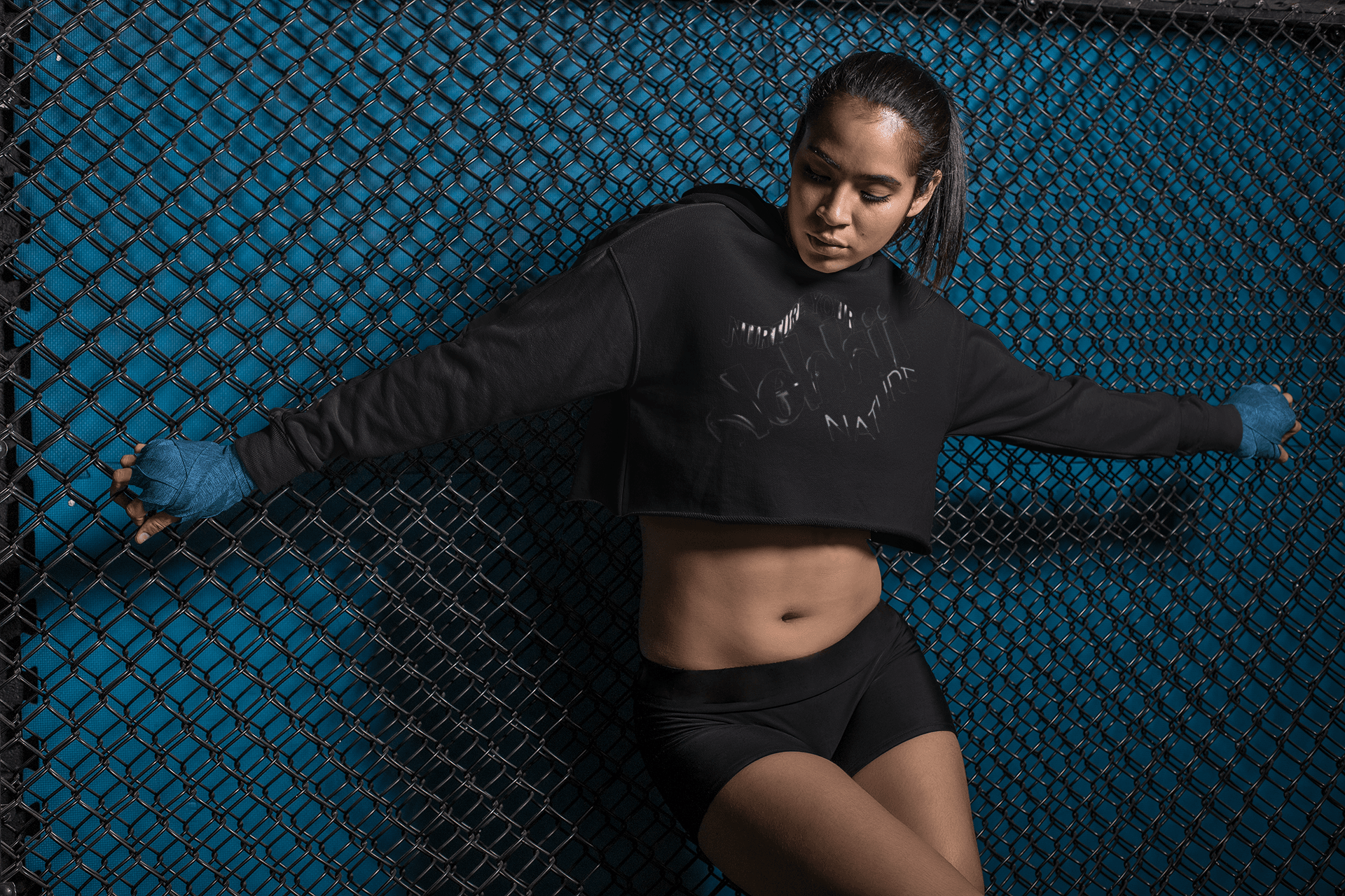 Women's Graphic Hoodie - Bold Style Fierce Spirit in black, cropped hoodie with subtle black-on-black print, sleek and fierce for modern wear.
