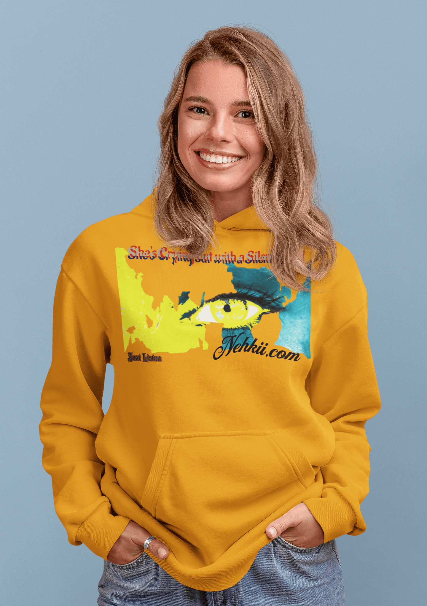 Women’s Prove Strong Hoodie in mustard yellow featuring artistic eye design and motivational quote. Cozy apparel for confident expression.