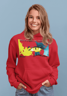 Red Women’s Prove Strong Hoodie featuring striking eye illustration and motivational text. Bold and cozy choice for women’s apparel.