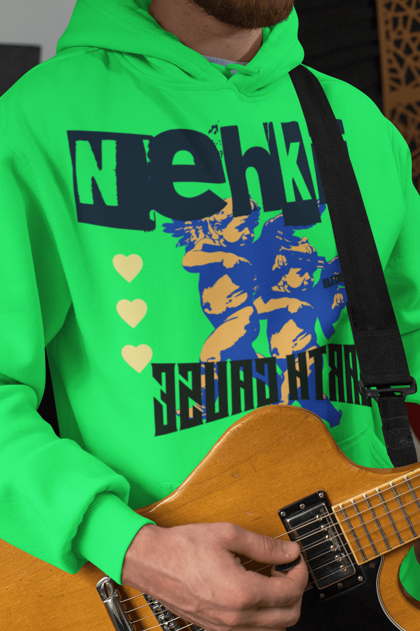 Green eco-friendly cotton hoodie for men with bold blue graphic and heart accents, combining comfort with a strong environmental message.