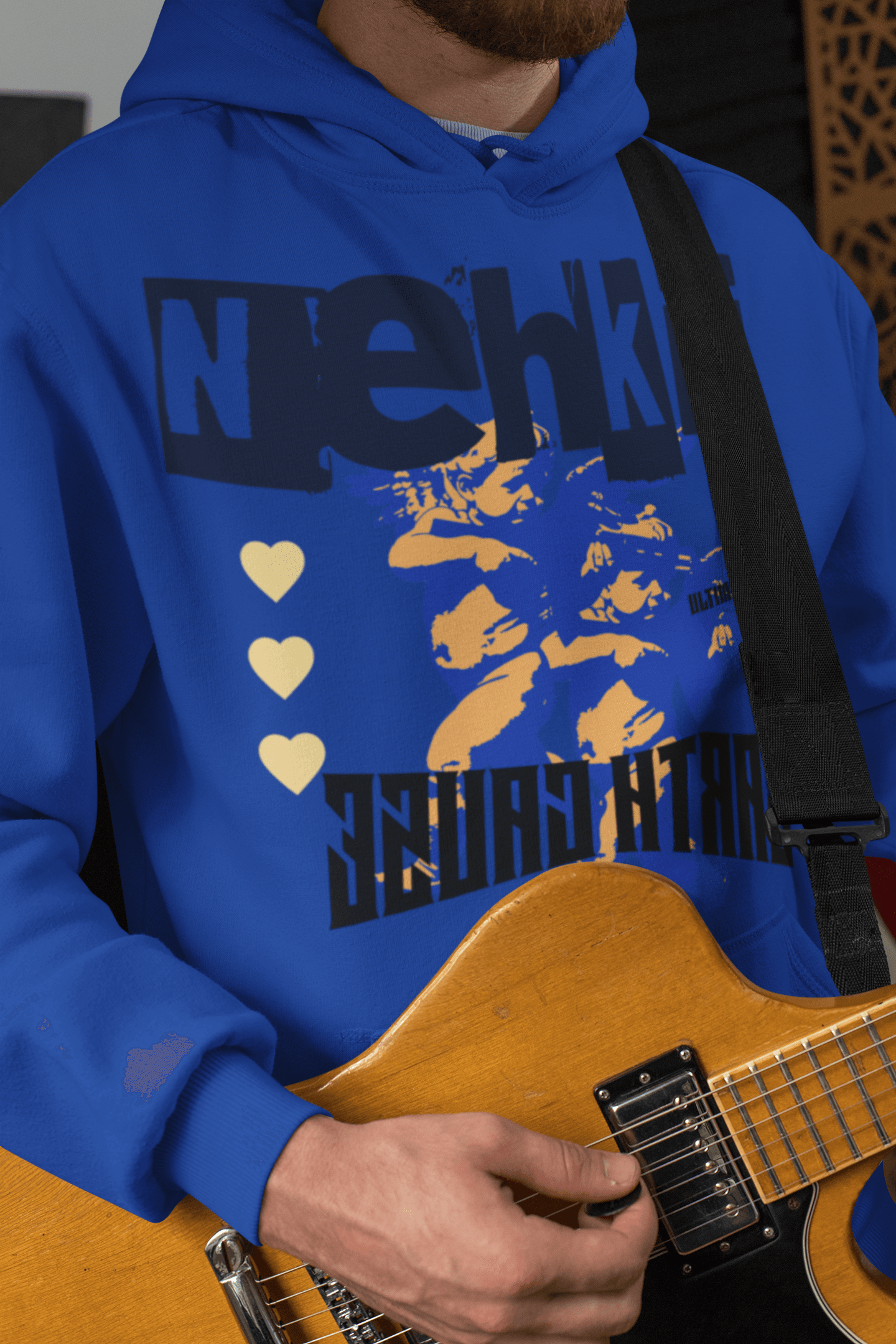 Royal blue men's hoodie crafted from 100% eco-friendly cotton, showcasing a bold graphic and heart motif for a stylish, sustainable look.
