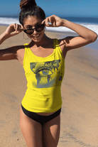 Spirit Tank Top for Women in bright yellow featuring a bold eye and world map graphic. Sustainable cotton tank top perfect for sunny outings.